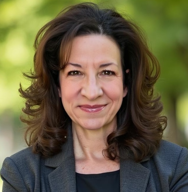 Suzanne Muller headshot in dark grey suit