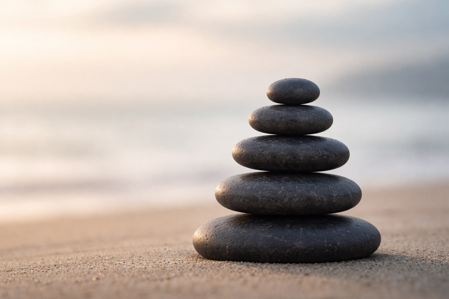 stones on the beach stacked for groundedness