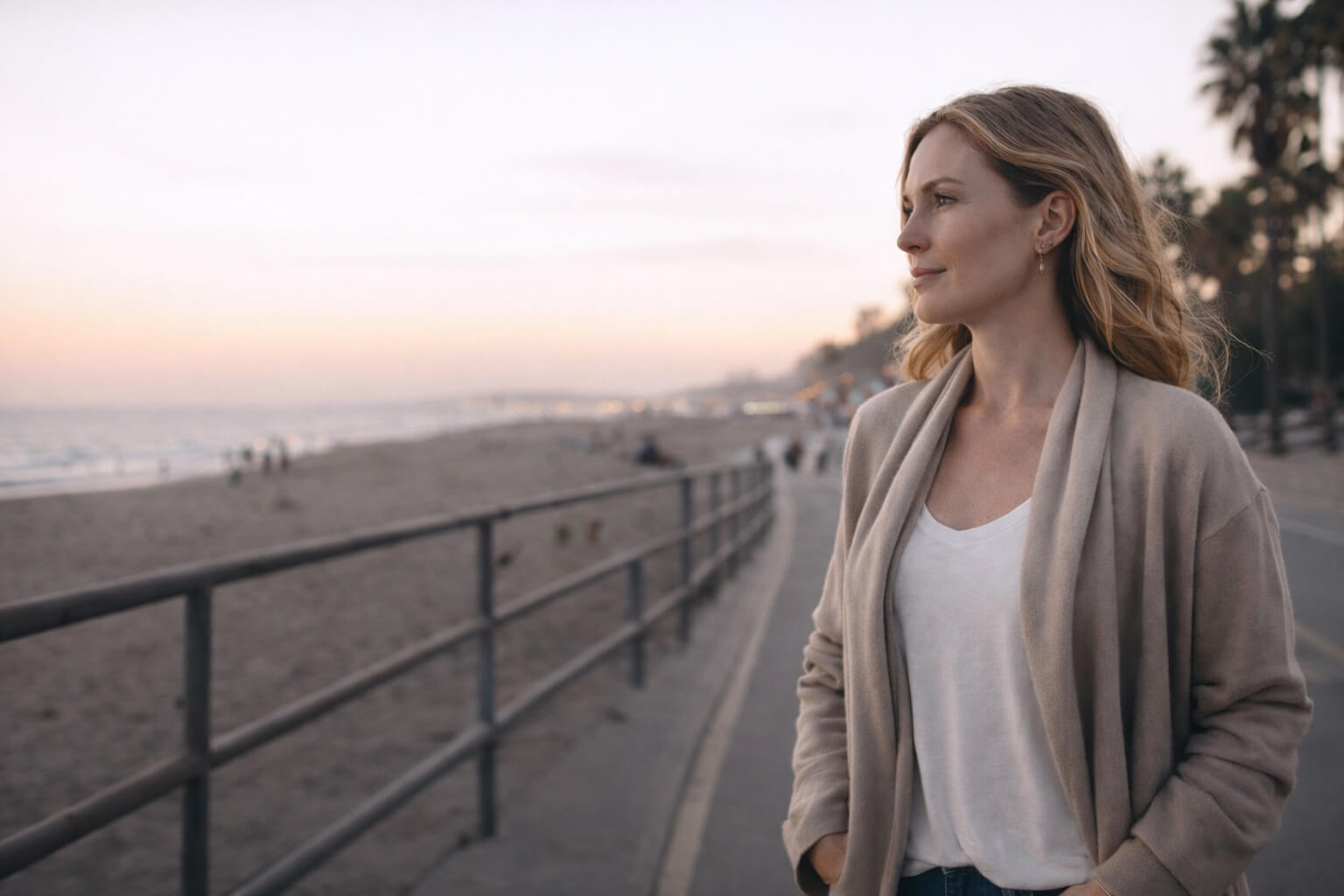 confident woman walking by the beach reflecting looking at the ocean